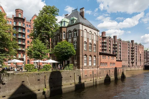 Wasserschloss am Holländischbrookfleet in the Speicherstadt , Hamburg , Germany The Speicherstadt was built between 1885 and 1927 as the world’s largest contiguous warehouse comple