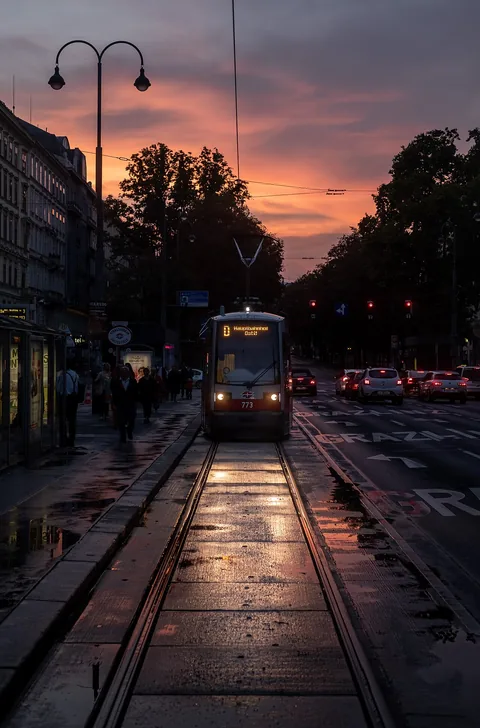 Tram in Kärntner Ring, at twilight, photograph taken from the back window of another tram (Vienna, Austria)