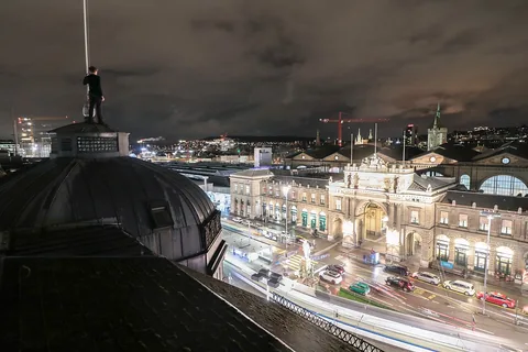 The picture shows a rooftopper on a building near the main train station in Zurich, Switzerland.